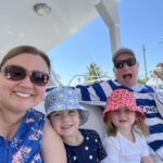 The Singing Suitcase owner Melissa with her husband Bill and two daughters on vacation on a boat