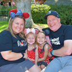 The Singing Suitcase owner Melissa with her family on the teacups ride at Disneyland.