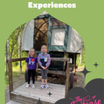 Two girls standing by a covered wagon with the text, "Unforgettable Cultural Experiences"