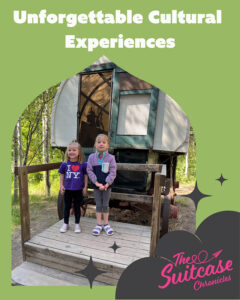 Two girls standing by a covered wagon with the text, "Unforgettable Cultural Experiences"